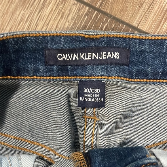 BARELY WORN Dark wash Calvin Klein, jeans skirt, with a few distressed marks - Picture 2 of 5